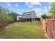 Spacious backyard with a well-maintained lawn and a wooden fence for added privacy at 1953 Azure Grove Ct, Marietta, GA 30008