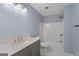 Bathroom featuring a vanity, tub, shower combo, and modern fixtures offers relaxation at 1953 Azure Grove Ct, Marietta, GA 30008