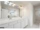 Bathroom featuring double sinks, large mirror, and walk in shower at 1953 Azure Grove Ct, Marietta, GA 30008