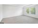 Spacious bedroom with neutral carpet, two windows bringing in natural light at 1953 Azure Grove Ct, Marietta, GA 30008
