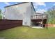 The house has a well-maintained lawn, with a brown stained deck and a concrete pad underneath at 1953 Azure Grove Ct, Marietta, GA 30008