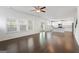 Open-concept living space with hardwood floors, white cabinets, and large windows at 1953 Azure Grove Ct, Marietta, GA 30008