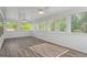 Sunroom features many windows providing ample views of the surrounding greenery and nature at 1953 Azure Grove Ct, Marietta, GA 30008