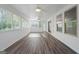 Bright sunroom boasts ceiling fans, hardwood floors and lots of windows for great views at 1953 Azure Grove Ct, Marietta, GA 30008