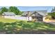 View of backyard featuring a well-maintained lawn, a white fence, and brick home exterior at 421 Hampton Rd, Fayetteville, GA 30215