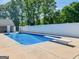 Backyard in-ground pool with diving board and basketball goal for fun and relaxation at 421 Hampton Rd, Fayetteville, GA 30215