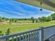 Inviting porch view reveals sprawling green lawns, horse paddock and clear blue skies at 421 Hampton Rd, Fayetteville, GA 30215