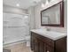 Bathroom features a modern vanity with a dark wood cabinet, a bright white countertop, and a glass-enclosed shower at 421 Hampton Rd, Fayetteville, GA 30215
