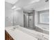 Modern bathroom showcasing double sinks, a large mirror, soaking tub, and a glass shower at 421 Hampton Rd, Fayetteville, GA 30215