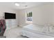 Bedroom with a bed, storage shelves, ceiling fan, and window overlooking a pool at 421 Hampton Rd, Fayetteville, GA 30215