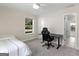 Bedroom with a bed, desk, ceiling fan, and views to a yard at 421 Hampton Rd, Fayetteville, GA 30215