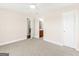 Bright bedroom with neutral walls, carpet, and views to a bathroom at 421 Hampton Rd, Fayetteville, GA 30215