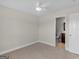 Bedroom with neutral carpet and ensuite bathroom access, providing convenience and privacy at 421 Hampton Rd, Fayetteville, GA 30215