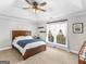 Bedroom with a bed, ceiling fan, large window, and neutral walls at 421 Hampton Rd, Fayetteville, GA 30215