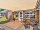 Backyard covered patio with wicker furniture offers ample seating and space for outdoor gatherings at 421 Hampton Rd, Fayetteville, GA 30215