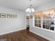 Bright dining room featuring modern lighting and a large window with outdoor views at 421 Hampton Rd, Fayetteville, GA 30215
