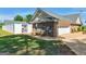 View of the exterior of the brick house with a pool in the backyard behind a white fence at 421 Hampton Rd, Fayetteville, GA 30215