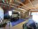 View of garage showing equipment, storage boxes, lawn mower and door to exterior at 421 Hampton Rd, Fayetteville, GA 30215