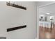 Entryway hallway leading to kitchen with a set of hooks installed on the wall at 421 Hampton Rd, Fayetteville, GA 30215