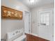 Inviting hallway features decorative artwork and direct access to the exterior door at 421 Hampton Rd, Fayetteville, GA 30215