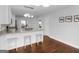 Open kitchen featuring white cabinetry, stainless steel appliances, and a breakfast bar with seating at 421 Hampton Rd, Fayetteville, GA 30215
