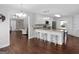 Open kitchen featuring white cabinetry, stainless steel appliances, and a breakfast bar with seating at 421 Hampton Rd, Fayetteville, GA 30215