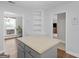 A view of the kitchen island shows the open floorplan with views to the living and dining areas at 421 Hampton Rd, Fayetteville, GA 30215
