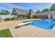 Large in-ground swimming pool with diving board, patio, and well-maintained lawn at 421 Hampton Rd, Fayetteville, GA 30215