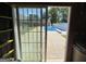View from garage through glass sliding door to back yard and pool with diving board at 421 Hampton Rd, Fayetteville, GA 30215