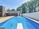 Backyard featuring a large in-ground swimming pool and well-maintained outdoor space at 421 Hampton Rd, Fayetteville, GA 30215