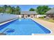 Inviting in-ground swimming pool surrounded by a well-kept lawn and patio area at 421 Hampton Rd, Fayetteville, GA 30215