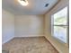 Bedroom featuring carpet flooring and a window provides ample natural light at 143 Tara Blvd, Loganville, GA 30052