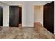 Bedroom with dark wood doors, stained concrete floors, and closet at 143 Tara Blvd, Loganville, GA 30052
