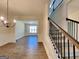 Elegant dining area with hardwood floors, wainscoting, and staircase access at 143 Tara Blvd, Loganville, GA 30052