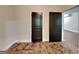Unfinished room featuring stained concrete floors and dark wood doors at 143 Tara Blvd, Loganville, GA 30052