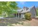 Charming home featuring manicured landscaping and traditional architectural details under a clear blue sky at 103 Fuller Ct, Grantville, GA 30220