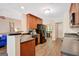 Well-equipped kitchen with dark appliances, sleek countertops, and an open layout connecting to the living area at 103 Fuller Ct, Grantville, GA 30220