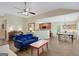 Comfortable living room with stylish furnishings, wood floors, and seamless connection to the kitchen and dining areas at 103 Fuller Ct, Grantville, GA 30220
