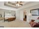 Spacious main bedroom with a sitting area and tray ceiling at 103 Fuller Ct, Grantville, GA 30220