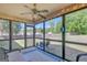 Charming sunroom with ample natural light, ceiling fan, and views of the backyard at 103 Fuller Ct, Grantville, GA 30220