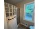 Updated bathroom featuring glass block shower and window at 716 Wilkes Dr, Loganville, GA 30052