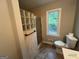Bathroom featuring a glass block shower and window at 716 Wilkes Dr, Loganville, GA 30052