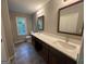 Spacious bathroom with double vanity and natural lighting at 716 Wilkes Dr, Loganville, GA 30052