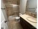Tiled bathroom featuring shower and vanity at 716 Wilkes Dr, Loganville, GA 30052