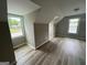 Bedroom featuring a window and modern flooring at 716 Wilkes Dr, Loganville, GA 30052