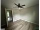 This bedroom features modern flooring and a ceiling fan at 716 Wilkes Dr, Loganville, GA 30052