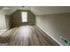 Bedroom with a window and modern flooring at 716 Wilkes Dr, Loganville, GA 30052