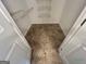 Empty walk-in closet with shelving and tiled flooring at 716 Wilkes Dr, Loganville, GA 30052