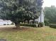 Exterior angle of home with large tree in front at 716 Wilkes Dr, Loganville, GA 30052