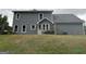 Exterior of home featuring gray siding, windows, well-maintained lawn and privacy fence at 716 Wilkes Dr, Loganville, GA 30052